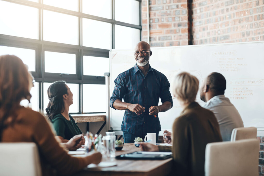 A CIT investment professional presenting retirement planning strategy to his team